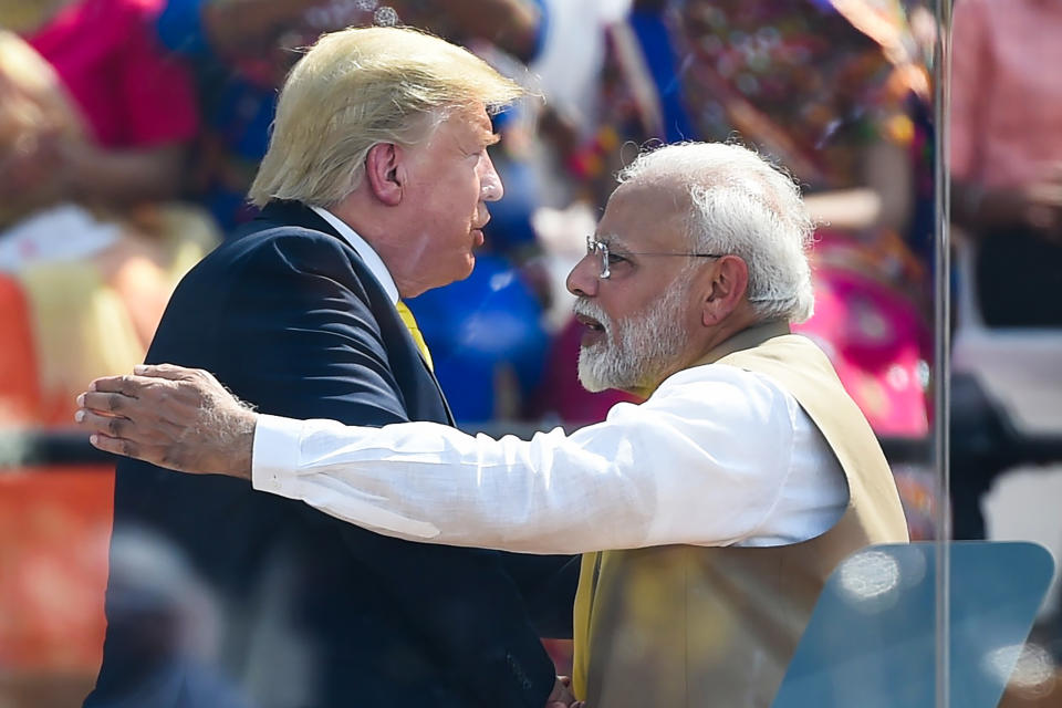 India's Prime Minister Narendra Modi (R) shakes hands with US President Donald Trump during 'Namaste Trump' rally at Sardar Patel Stadium in Motera, on the outskirts of Ahmedabad, on February 24, 2020. (Photo by Money SHARMA / AFP) (Photo by MONEY SHARMA/AFP via Getty Images)