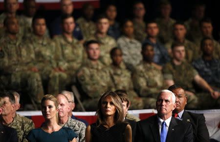 Senior adviser to and daughter of the President Ivanka Trump, first lady Melania Trump and Vice President Mike Pence (L-R) listen as U.S. President Donald Trump announces his strategy for the war in Afghanistan during an address to the nation from Fort Myer, Virginia, U.S., August 21, 2017. REUTERS/Joshua Roberts
