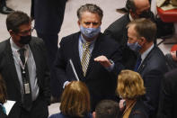 Ukrainian Ambassador to the United Nations Sergiy Kyslytsya, center, talks to people before a Security Council meeting at United Nations headquarters, Sunday, Feb. 27, 2022. (AP Photo/Seth Wenig)