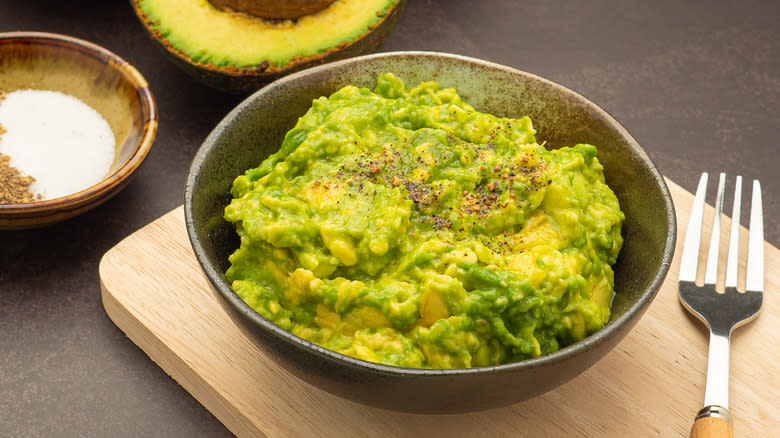 Bowl of guacamole with fork