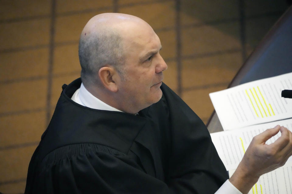 Associate Justice Robert Chamberlin of the Mississippi Supreme Court questions attorneys arguing over a state law that would put $10 million of federal pandemic relief money into infrastructure grants for private schools, Tuesday, Feb. 6, 2024, in Jackson, Miss. (AP Photo/Rogelio V. Solis)