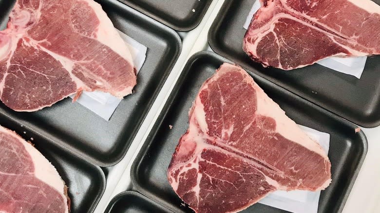 USDA Select raw porterhouse steaks 