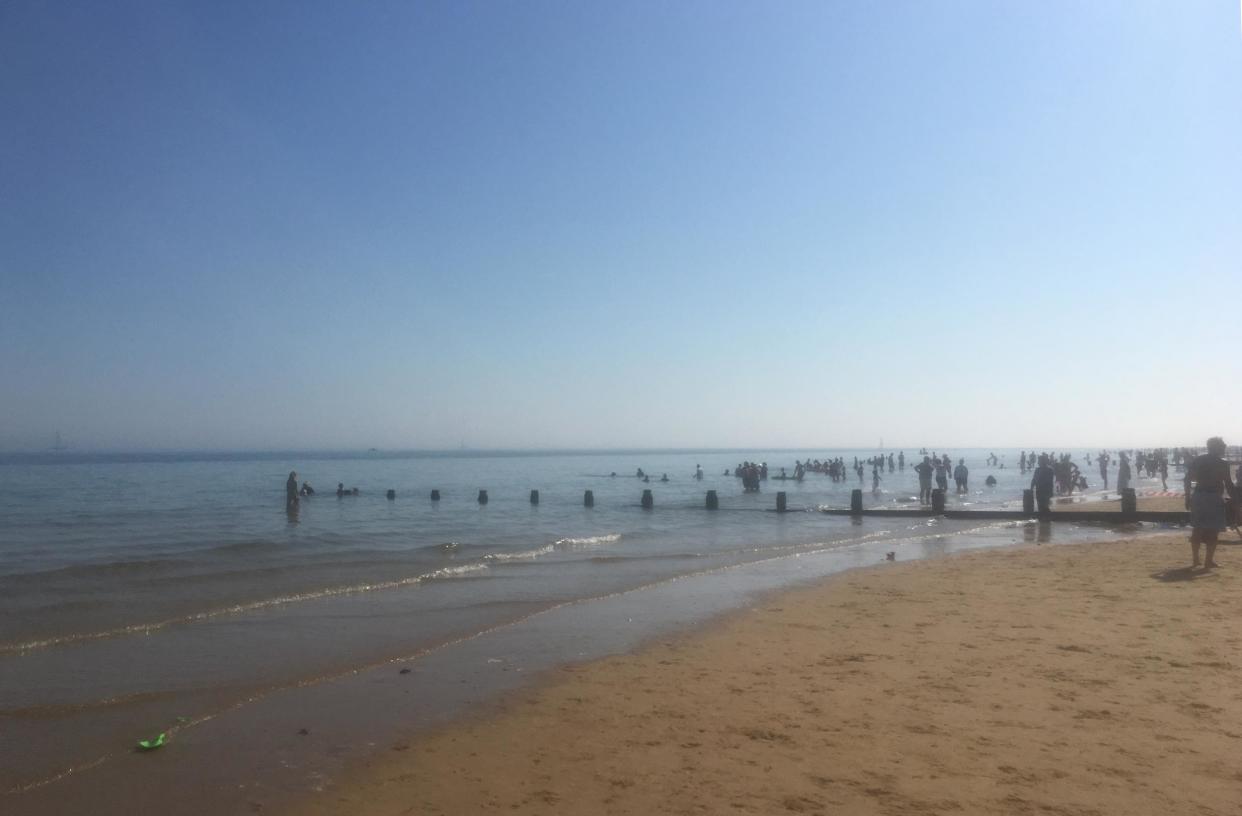 A warning tape is set at the beach in Frinton, Essex, as emergency services received several reports of people coughing and struggling to breathe: PA Wire/PA Images