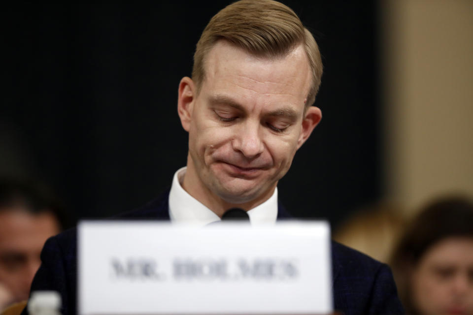 David Holmes, a U.S. diplomat in Ukraine, pauses as he testifies before the House Intelligence Committee on Capitol Hill in Washington, Thursday, Nov. 21, 2019, during a public impeachment hearing of President Donald Trump's efforts to tie U.S. aid for Ukraine to investigations of his political opponents.. (AP Photo/Andrew Harnik)