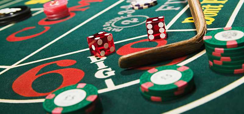 Close up of a craps table in a casino.