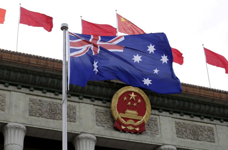 FILE PHOTO: Australian flag waves in front of the Great Hall of the People in Beijing