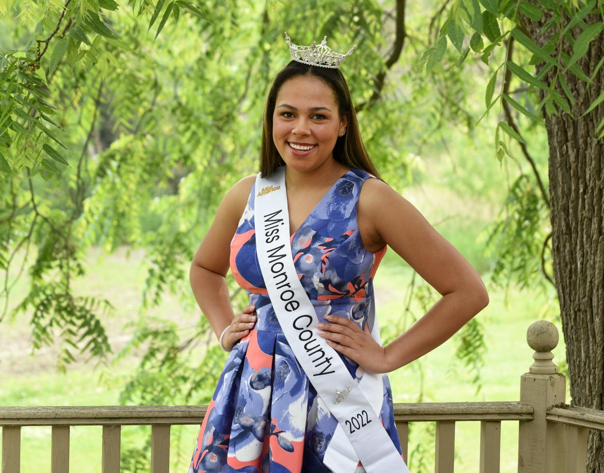 Miss Monroe County Payton Perry-Radcliffe, shown at her LaSalle home, is leaving for the Miss Michigan competition today. "My grandpa (Ritch Radcliffe) and I used to see who could throw the walnuts from the trees the furthest here from this deck when I was in preschool," Perry-Radcliffe said.