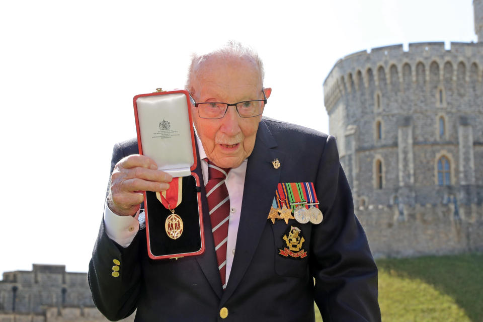 100-year-old WWII veteran Captain Tom Moore poses with his medal after being made a Knight Bachelor during an investiture at Windsor Castle in Windsor, west of London on July 17, 2020. - British World War II veteran Captain Tom Moore was made a a Knight Bachelor (Knighthood) for raising over £32 million for the NHS during the coronavirus pandemic. (Photo by Chris Jackson / POOL / AFP) (Photo by CHRIS JACKSON/POOL/AFP via Getty Images)