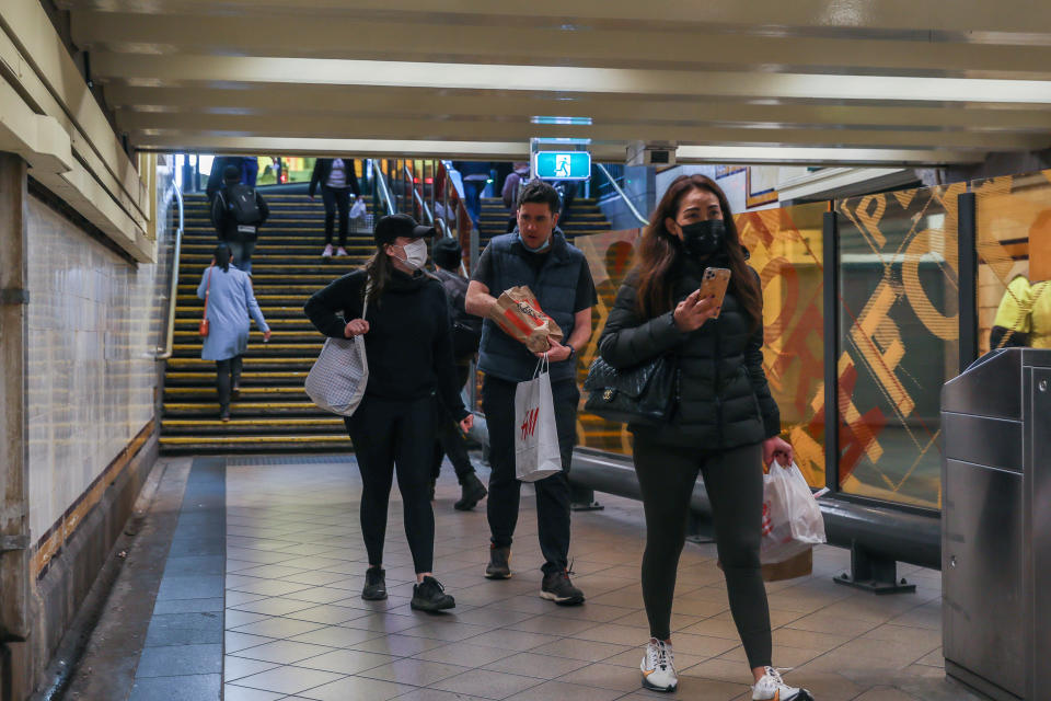 MELBOURNE, AUSTRALIA - NOVEMBER 06: Pedestrians are seen walking along the Flinders Street Station underpass on November 06, 2020 in Melbourne, Australia. Lockdown restrictions in Melbourne were lifted on 28 October, with people now able to leave their homes for any reason. Cafes, restaurants, pubs and bars can reopen subject to patron limits while beauty services, tattoo parlours and any other service where you can wear a mask will be able to resume. Up to 10 people from any number of households will be able to gather outdoors, however, Victorians are still required to wear a face mask in public.  (Photo by Asanka Ratnayake/Getty Images)