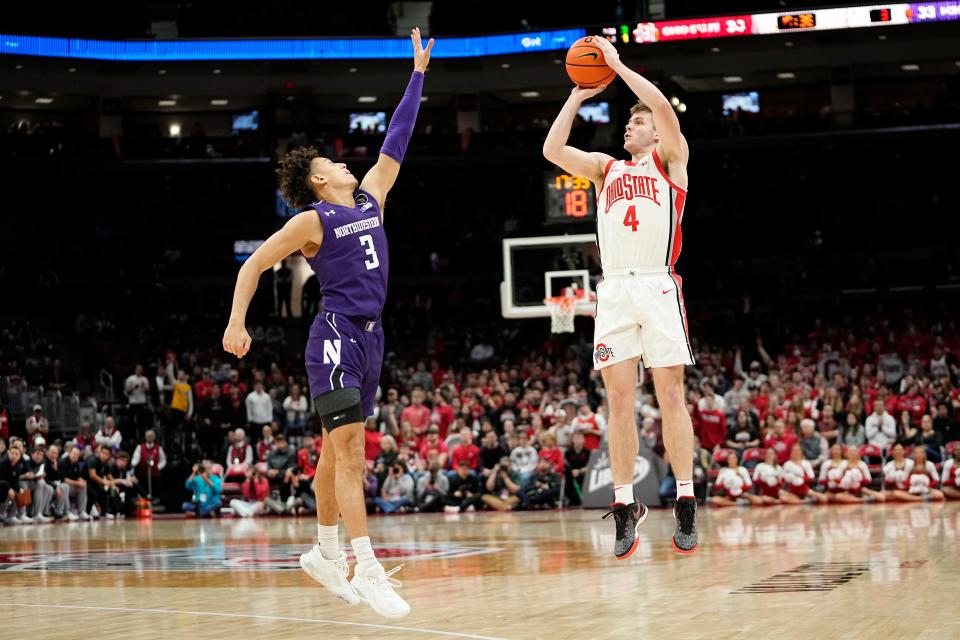 Feb 9, 2023; Columbus, OH, USA;  Ohio State Buckeyes guard Sean McNeil (4) shoots a three pointer over Northwestern Wildcats guard Ty Berry (3) during the second half of the NCAA men’s basketball game at Value City Arena. Ohio State lost 69-63. Mandatory Credit: Adam Cairns-The Columbus Dispatch