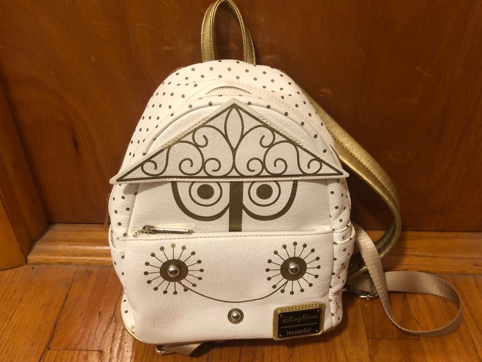 small world loungefly bag from disney parks