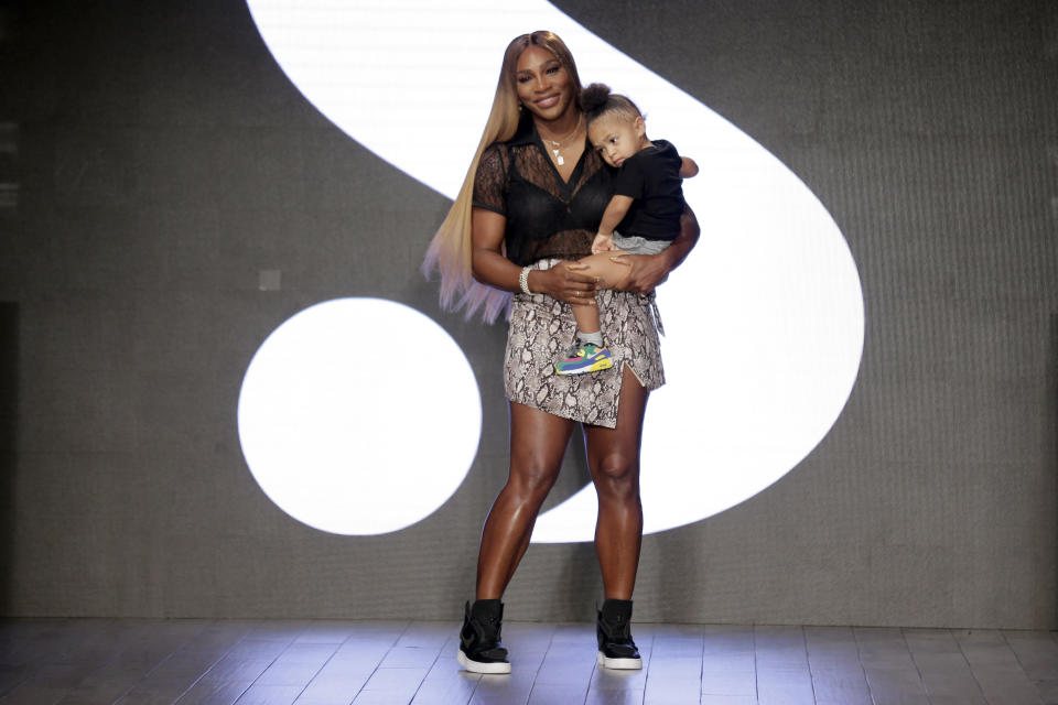File-This Sept. 10, 2019, file photo shows Serena Williams holding her daughter Alexis Olympia Ohanian Jr. after showing her clothing line during New York's Fashion Week in New York. Williams has been voted the AP Female Athlete of the Decade for 2010 to 2019. Williams won 12 of her professional-era record 23 Grand Slam singles titles over the past 10 years. No other woman won more than three in that span. She also tied a record for most consecutive weeks ranked No. 1 and collected a tour-leading 37 titles in all during the decade. Gymnast Simone Biles finished second in the vote by AP member sports editors and AP beat writers. Swimmer Katie Ledecky was third, followed by ski racers Lindsey Vonn and Mikaela Shiffrin. (AP Photo/Seth Wenig, File)