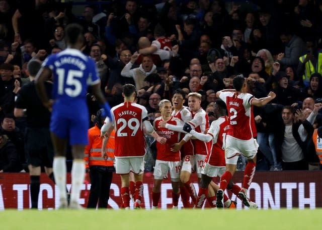 Arsenal’s Leandro Trossard (centre) celebrates with his team-mates after scoring at Chelsea