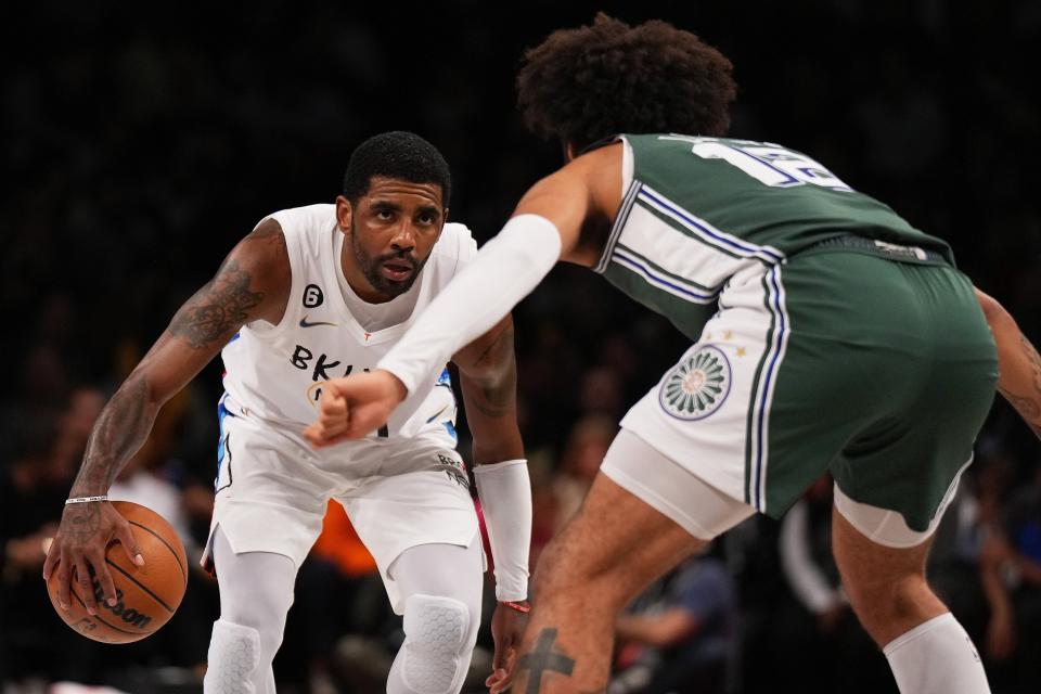 Nets guard Kyrie Irving drives to the basket against Pistons forward Isaiah Livers during the Pistons' 130-122 win on Thursday, Jan. 26, 2023, in New York.