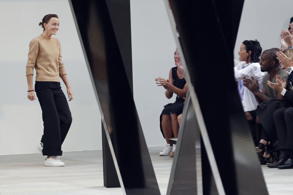 British fashion designer Phoebe Philo  acknowledges the audience at the end of the Celine 2015 Spring/Summer ready-to-wear collection fashion show, on September 28, 2014 in Paris.       AFP PHOTO / FRANCOIS GUILLOT        (Photo credit should read FRANCOIS GUILLOT/AFP via Getty Images)