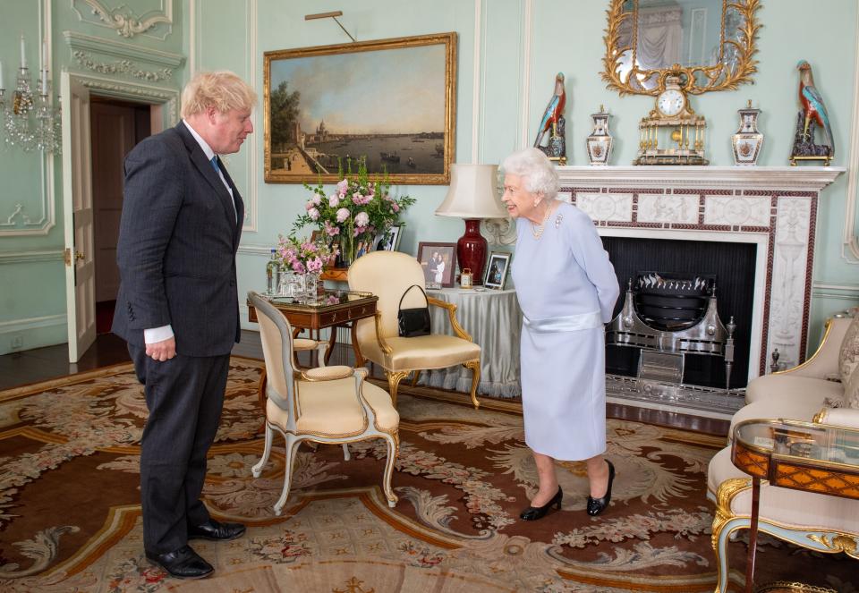 Queen Elizabeth II greeting Boris Johnson at Buckingham Palace for their first in-person weekly audience during the coronavirus pandemic (PA) (PA Wire)