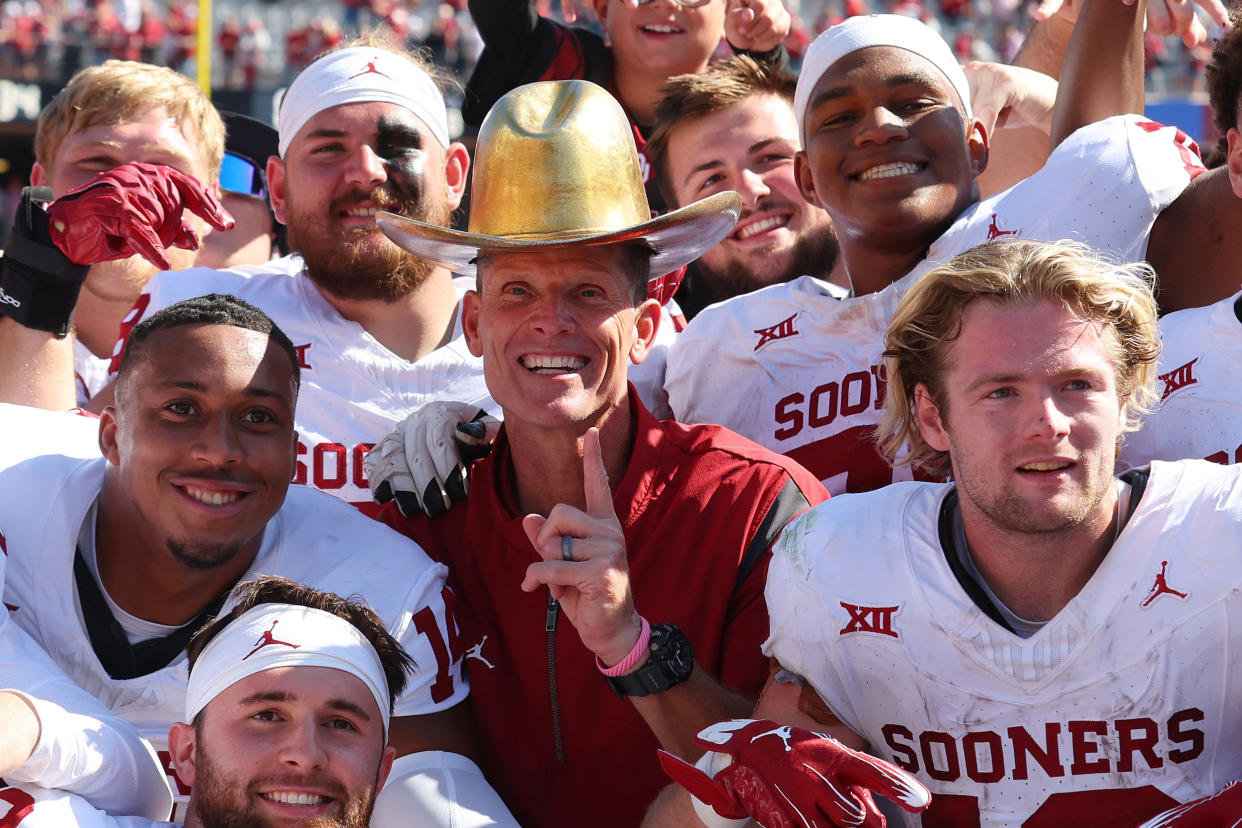 The Sooners are all smiles after Saturday's win. (Richard Rodriguez/Getty Images)