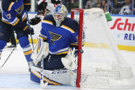 St. Louis Blues goalie Jordan Binnington (50) makes a save against the Arizona Coyotes during the first period of an NHL hockey game Thursday, Feb. 20, 2020, in St. Louis. (AP Photo/Dilip Vishwanat)