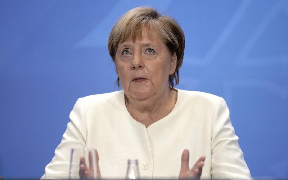 German Chancellor Angela Merkel attends a press conference after a video conference with State Premiers on the country's response to the new coronavirus pandemic on September 29, 2020 in Berlin. (Photo by Kay Nietfeld / POOL / AFP) (Photo by KAY NIETFELD/POOL/AFP via Getty Images) - KAY NIETFELD/ AFP