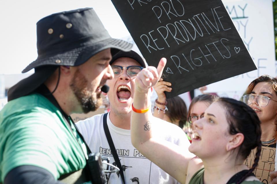 Abortion-rights protesters yell at a counter protester during a pro-choice protest on Monday, July 4, 2022. The counter protest was holding an Abolish Human Abortions sign. Community members of all ages rallied in protest of the Supreme Court of the United States' decision to overturn Roe v. Wade on Friday, June 24. Following the protest, the Party for Socialism and Liberation held a march to the federal courthouse.