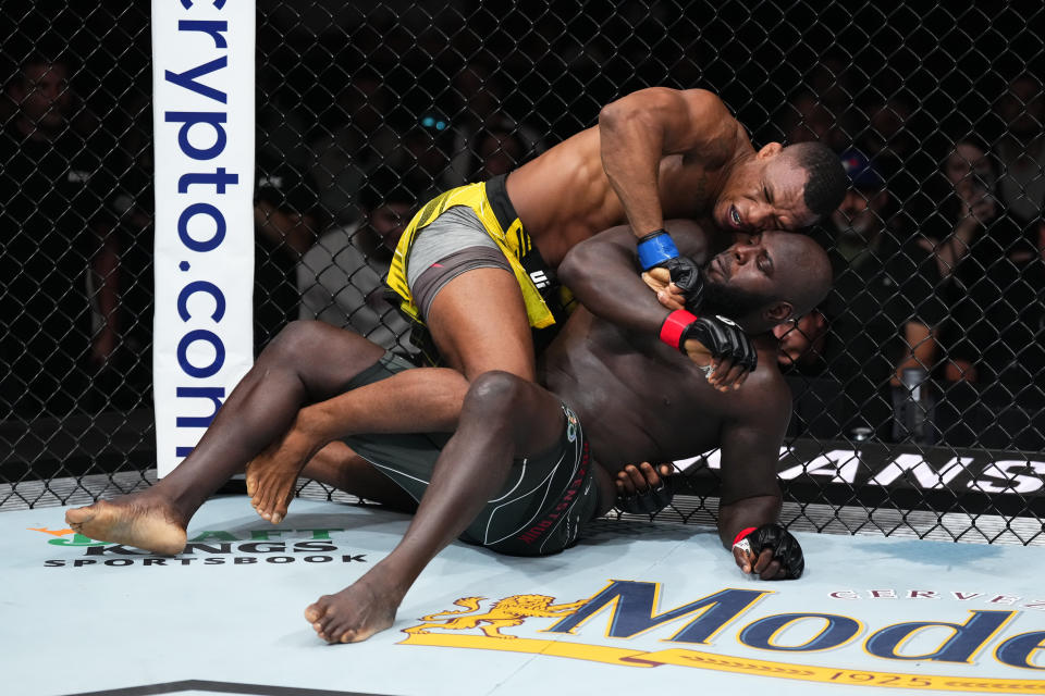 Jailton Almeida (left) punches Jairzinho Rozenstruik in their heavyweight fight during the UFC Charlotte on May 13, 2023 in Charlotte, North Carolina. (Jeff Bottari/Zuffa LLC via Getty Images)