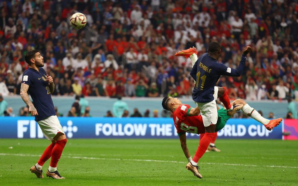 Morocco's Jawad El Yamiq shoots at goal - REUTERS/Kai Pfaffenbach