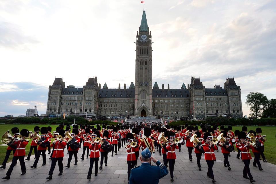 Members of the Band of the Ceremonial Guard march off in front of reviewing officer Lieutenant-General J.A.J. Parent, centre, at the conclusion of Fortissimo, a military and musical performance, on Parliament Hill in Ottawa on Saturday, July 22, 2017.