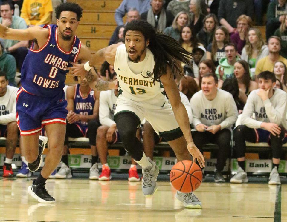 Vermont's Dylan Penn drives to the hoop during the Catamounts' 93-81 America East Conference win over UMass Lowell at Patrick Gym on Saturday, Feb. 11, 2023.