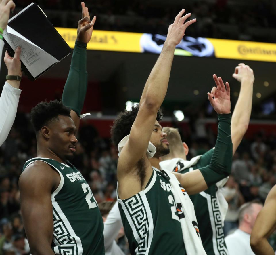 Michigan State center Mady Sissoko, left, and forward Malik Hall, center, react after a score during the second half of MSU's 88-64 win over Baylor on Saturday, Dec.16, 2023, at Little Caesars Arena.