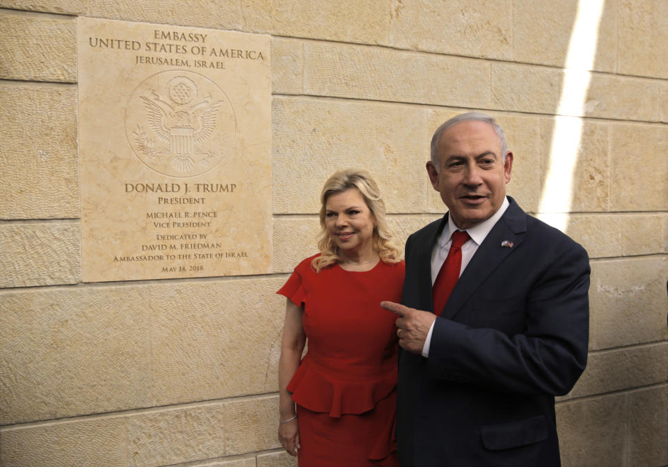 FILE - In this May 14, 2018, file photo, Israeli Prime Minister Benjamin Netanyahu, right, and his wife Sara attend the opening ceremony of the new U.S. Embassy in Jerusalem. U.S. President Donald Trump has sided with Israel on key issues related to the conflict with the Palestinians, and Netanyahu has boasted of his close ties to the American president, saying they have brought about unprecedented gains for Israel. (AP Photo/Sebastian Scheiner, File)