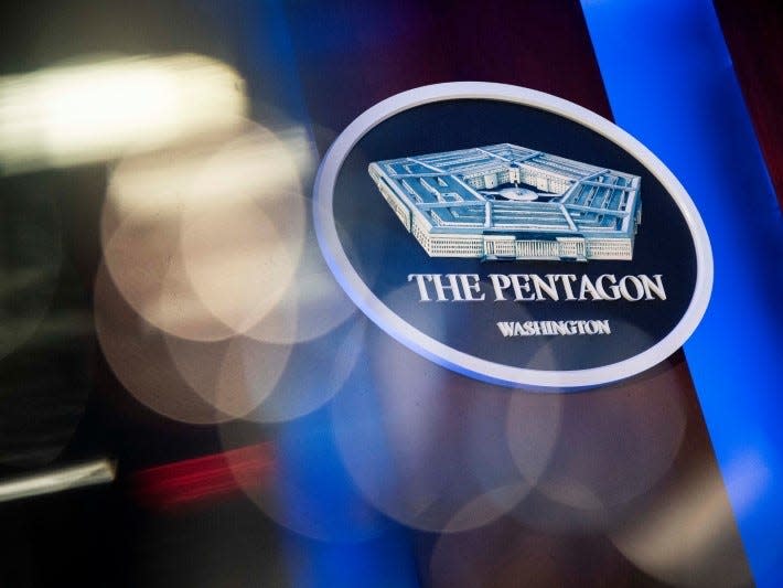 FILE PHOTO: The Pentagon logo is seen behind the podium in the briefing room at the Pentagon in Arlington, Virginia, U.S., January 8, 2020. REUTERS/Al Drago