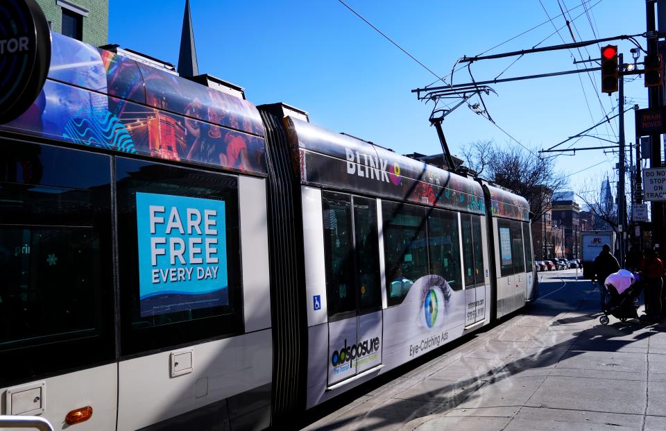 The Connector, Cincinnati’s electric streetcar, makes its way down Race Street at Findlay Market in Over-the-Rhine, Thursday, Dec. 14, 2023. It makes a 3.6-mile loop through OTR, downtown and The Banks. The streetcar began operation in October 2016 and in September 2020 switched to free rides.