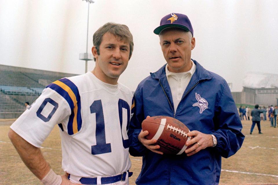 Minnesota Vikings quarterback Fran Tarkenton poses with coach Bud Grant during a practice, Jan. 7, 1974.