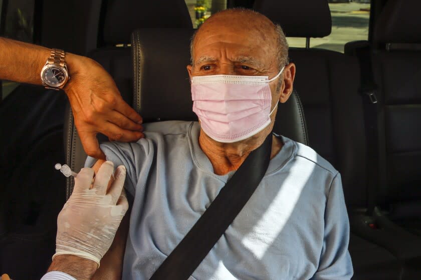 La Canada Flintridge, CA - November 16: Mardiros Ebrahamian, 82, gets a boaster shot Moderna vaccine for COVID19 at Flintridge Pharmacy on Tuesday, Nov. 16, 2021 in La Canada Flintridge, CA. (Irfan Khan / Los Angeles Times)