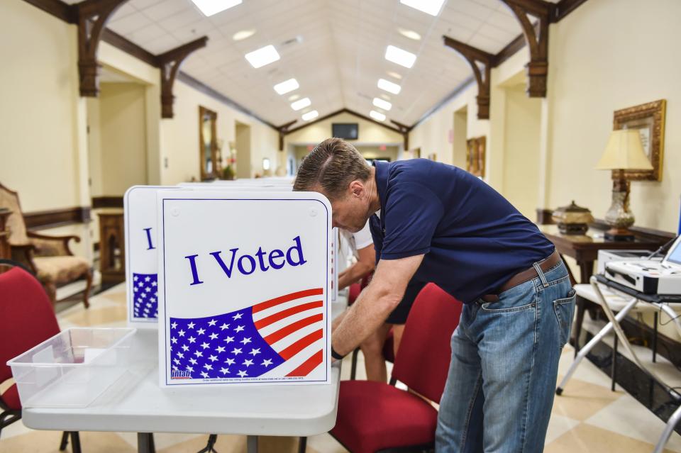 Republican U.S. Rep. Michael Guest, of Mississippi District 3, votes at Brandon Baptist Church in Brandon, Miss., in the Mississippi Congressional primary, Tuesday, June 7, 2022.