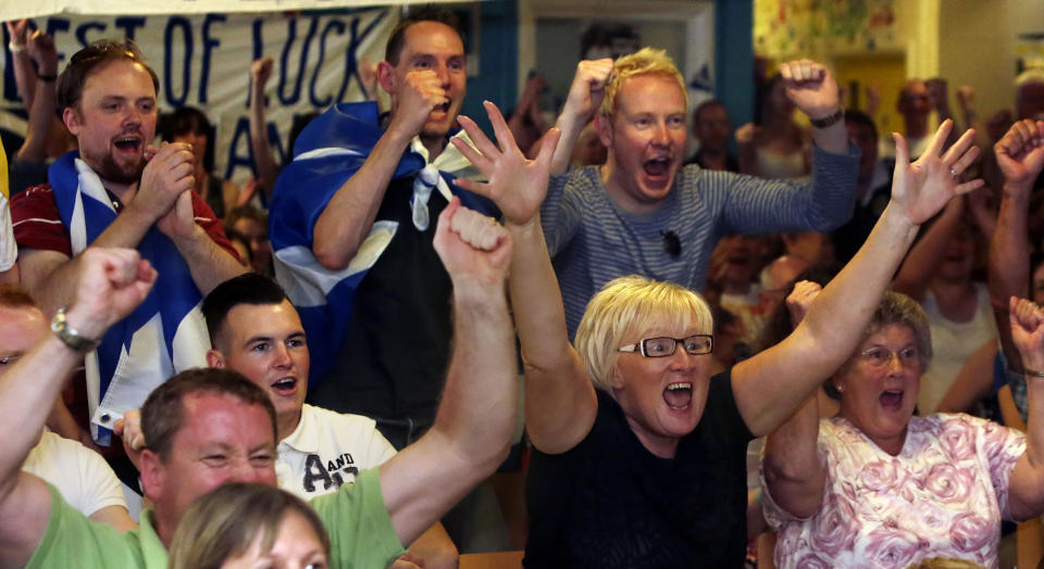 Fans react during the 1st Set while watching the Andy Murray v Novak Djokovic Wimbledon final on a screen at the Dunblane Centre in Andy Murray's home town of Dunblane in Scotland.