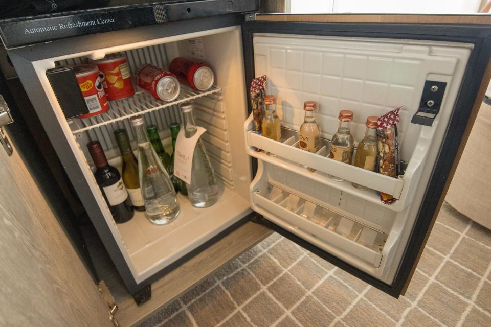 small mini fridge stocked with drinks