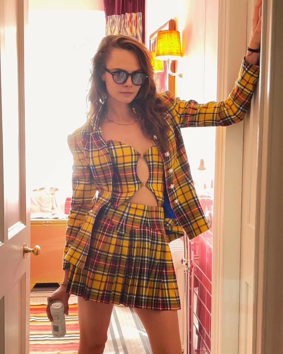 The model-actress gave a shout out to a classic line from Clueless in the caption of a July 6, 2021, Instagram photo wearing a yellow plaid vest, blazer and pleated miniskirt by Amuse Bouche. "You might be surprised to know I’m not actually a virgin and I can drive," Cara quipped, referring to late actress Brittany Murphy's epic "way harsh" putdown of Alicia's Cher.