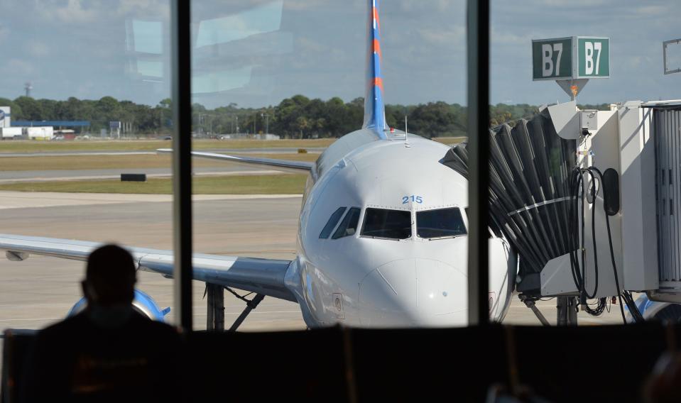 A passenger waits to board an Allegiant Air flight at Sarasota-Bradenton International Airport.