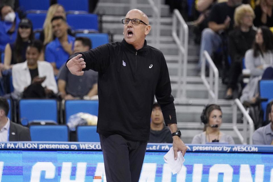 Long Beach State coach Alan Knipe talks to the team during an NCAA men's volleyball tournament against UCLA in 2022.