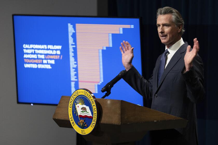 California Gov. Gavin Newsom displays a chart aimed at refuting critics of California's laws dealing with property crime during a news conference where he unveiled his proposed state budget for the 2024-2025 fiscal year, in Sacramento, Calif., Wednesday, Jan. 10, 2024. (AP Photo/Rich Pedroncelli)