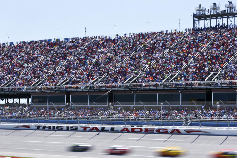 Drivers race past Talladega fans during a NASCAR Talladega auto race at Talladega Superspeedway, Sunday, April 29, 2018, in Talladega, Ala. (AP Photo/Brynn Anderson)