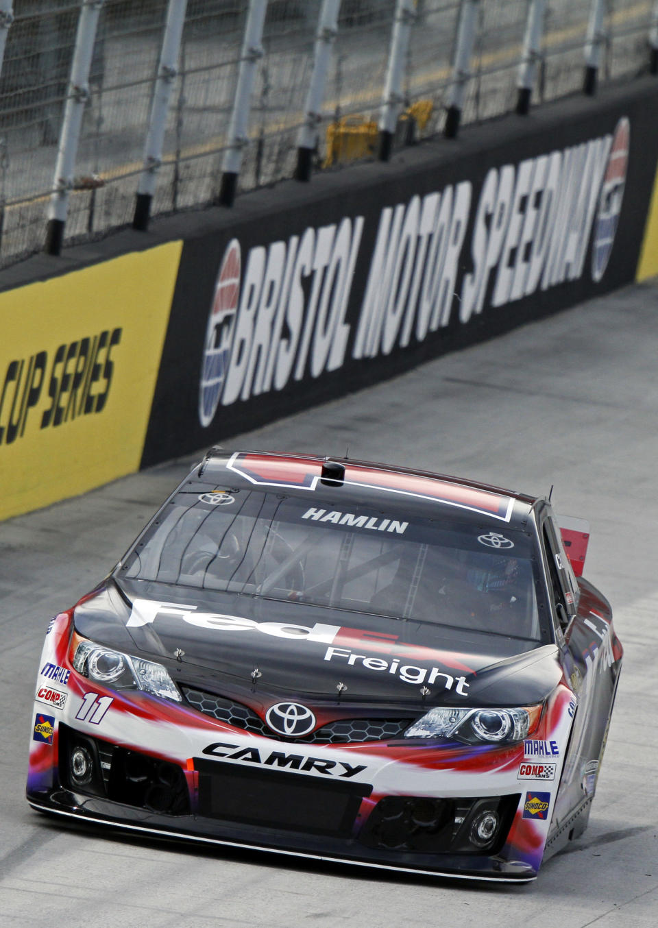 Driver Denny Hamlin makes his way around the track during qualifying for the NASCAR Sprint Cup series auto race at Bristol Motor Speedway on Friday, March 14, 2014, in Bristol, Tenn. Hamlin will start on the pole for Sunday's race. (AP Photo/Wade Payne)