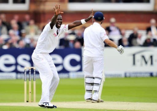 West Indies' captain Darren Sammy (L) appeals unsuccessfully for the wicket of England's Jonathan Trott (R) during the second day of the first Test at Lord's cricket ground in London