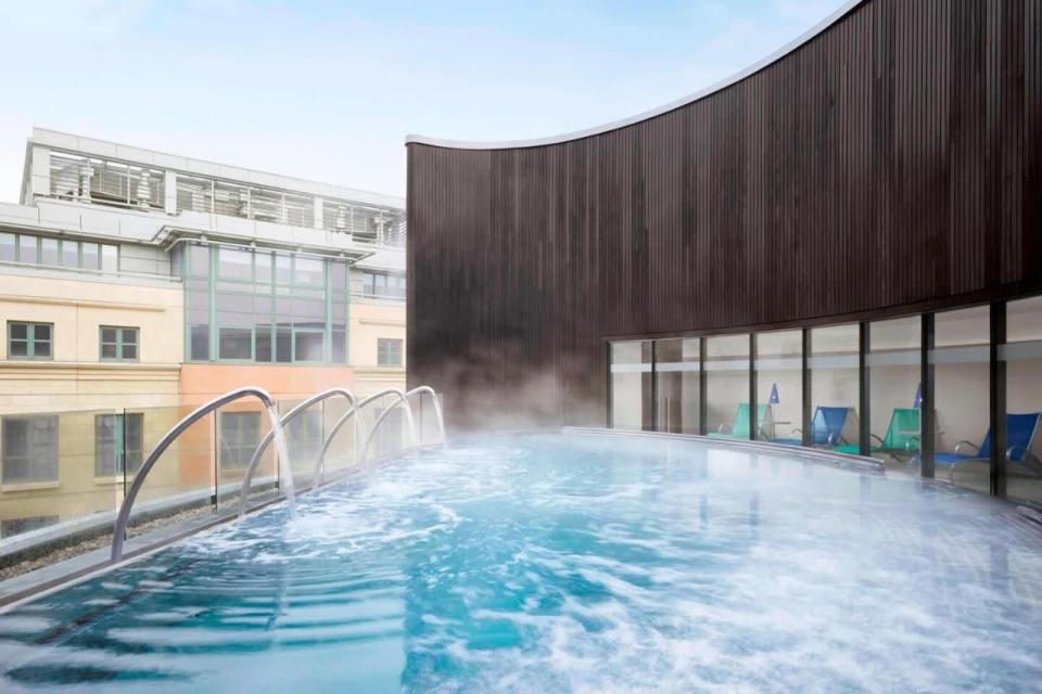 <p>Another spa hotel in Scotland with a showpiece hydropool on its rooftop, <a href="https://www.booking.com/hotel/gb/grdhotelspaedinburgh.en-gb.html?aid=1922306&label=spa-hotels-scotland" rel="nofollow noopener" target="_blank" data-ylk="slk:Sheraton Grand Hotel & Spa" class="link rapid-noclick-resp">Sheraton Grand Hotel & Spa</a> also has a 19-metre indoor pool, fitness studio and thermal suite, which has a range of salt-, water- and heat-based experiences to aid your relaxation. Treatments include body wraps and scrubs, couple’s options and facials, and there’s a selection of ayurvedic rituals, too. </p><p>Visitors can also book in with a fitness counsellor, or try one of the special hair and scalp treatments. There may be a hectic city outside, but you won’t know it by the fire in the relaxation area, where the loungers are under-lit with a soothing magenta glow.</p><p><a class="link rapid-noclick-resp" href="https://www.booking.com/hotel/gb/grdhotelspaedinburgh.en-gb.html?aid=1922306&label=spa-hotels-scotland" rel="nofollow noopener" target="_blank" data-ylk="slk:CHECK AVAILABILITY">CHECK AVAILABILITY</a></p>