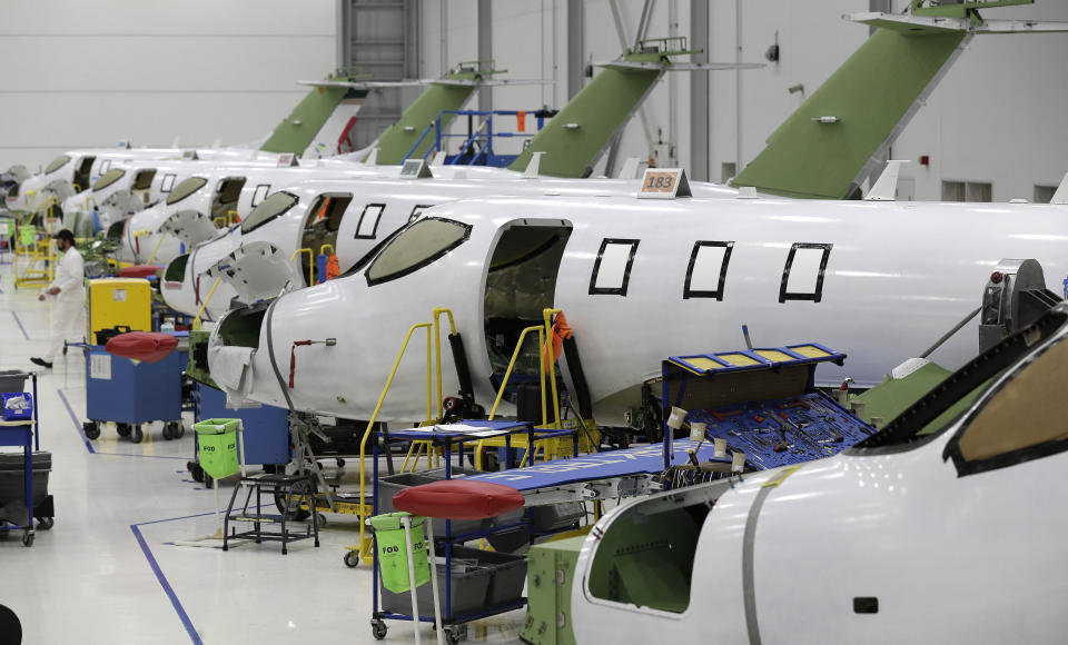 This July 30, 2019 shows the main production area at the Honda Aircraft Co. headquarters in Greensboro, N.C. where the HondaJet Elite aircraft is manufactured. Nearly four years after delivering its first jet, Honda is facing decisions as the company better known for cars and lawnmowers considers whether to sink billions more into its decades-in-the-making aircraft division. (AP Photo/Gerry Broome)