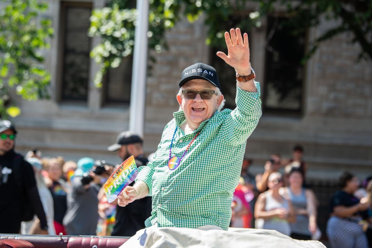 Parade grand marshal Leslie Jordan waves to the people on Broadway, while leading the pride parade in Nashville, Tenn., Saturday, June 25, 2022.