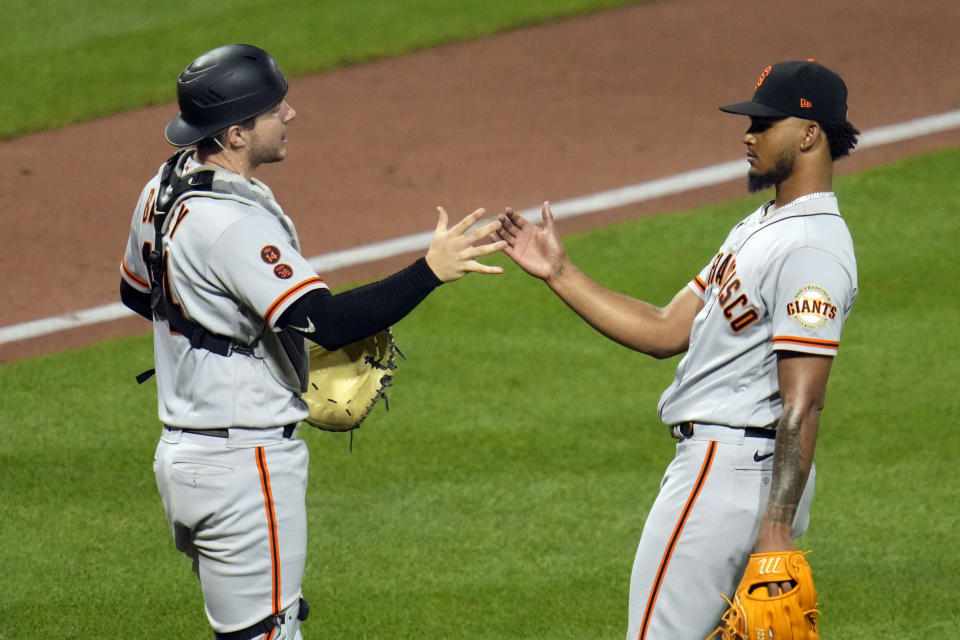 San Francisco Giants' relief pitcher Camilo Doval, right, celebrates with catcher Patrick Bailey after getting the final out of a baseball game against the Pittsburgh Pirates in Pittsburgh, Saturday, July 15, 2023. (AP Photo/Gene J. Puskar)