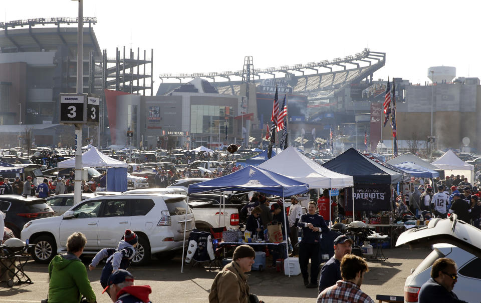 Fans tailgate in the parking lot of Gillette Stadium before the AFC championship NFL football game between the New England Patriots and the Jacksonville Jaguars, Sunday, Jan. 21, 2018, in Foxborough, Mass. (AP Photo/Winslow Townson)
