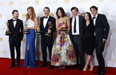 The cast of AMC's "Breaking Bad" poses with their outstanding drama series award at the 66th Primetime Emmy Awards in Los Angeles, California August 25, 2014. REUTERS/Mike Blake
